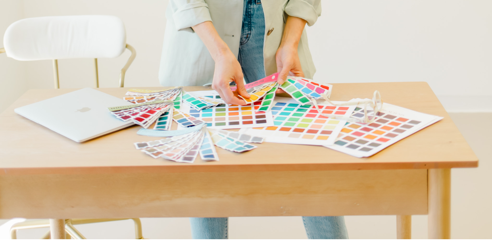 Megan, Colorbook's color analyst, drapes color palette swatches on the table during a Fort Collins color analysis session